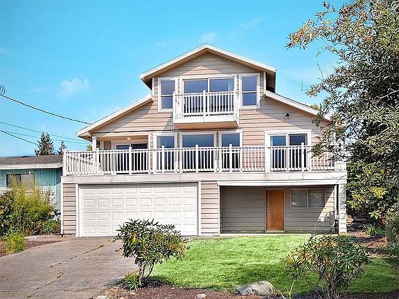 Rear - Alley access, separate entry to basement bedroom, large yard with trees