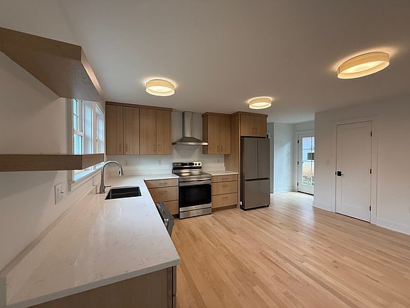 View towards back door (full glass) and pantry (closed door)