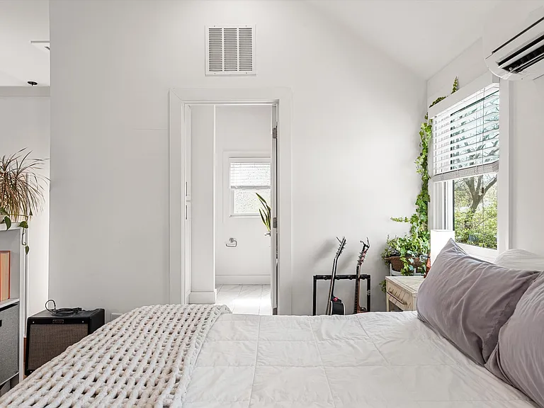 Open-concept studio space with vaulted ceilings and natural light.