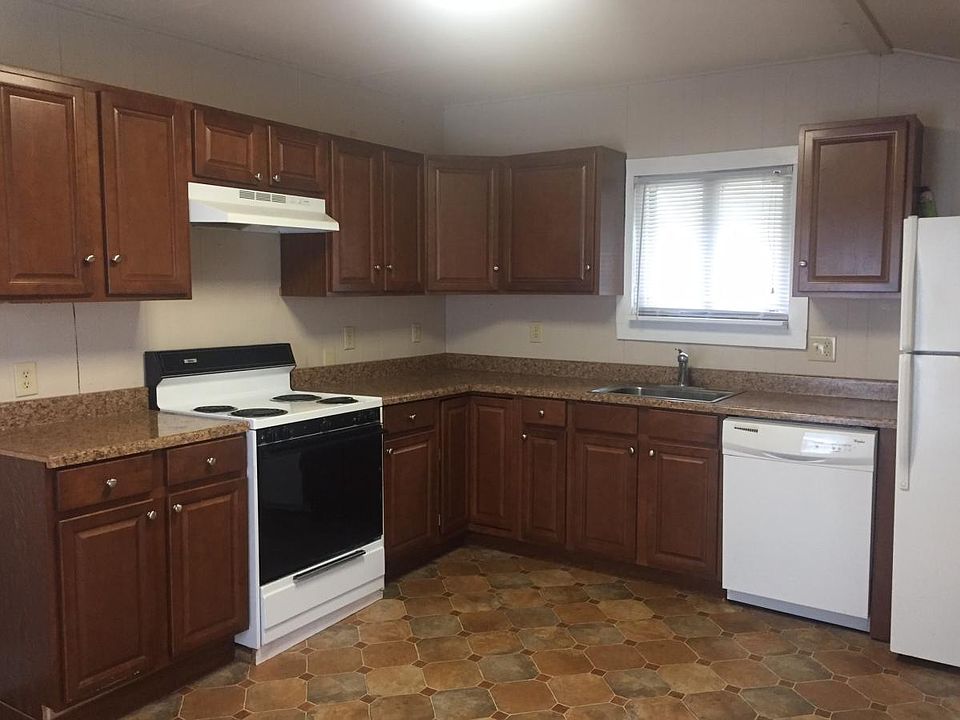 Check out this updated kitchen with plenty of cabinets and counter tops. Electric stove & Frig provided for your convenience. Don't forget the dishwasher.