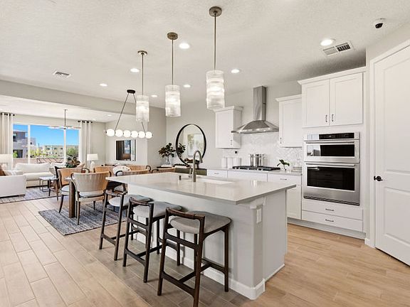The openness from the kitchen and cafe allow for seamless transitions from room to room while entert