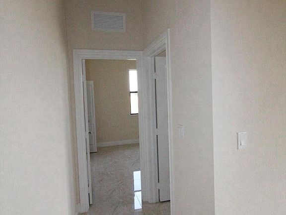 Hallway to Bedroom with its separate full bathroom