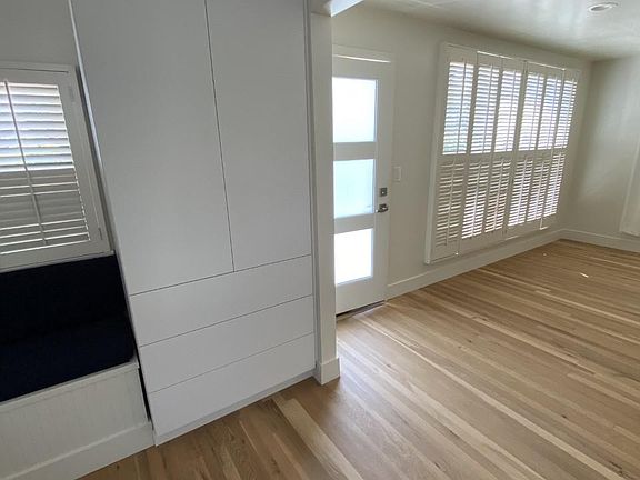 Another view of the entry and living room from the brand-new kitchen, which now has extra storage!