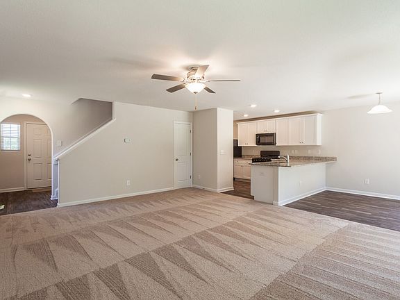 Open floor plan with arch detailing