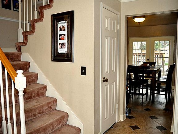 stairs and hallway leading to breakfast area.