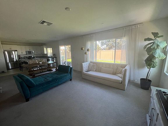 Open concept living room, dining room and kitchen. Views of the ocean, bay and downtown from this space on clear days.