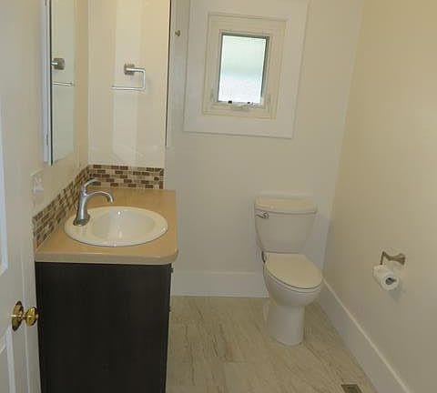Bathroom with new flooring and fixtures.