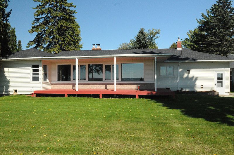 Back of house with deck facing Green Bay