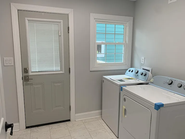 Huge laundry room leading to the back deck