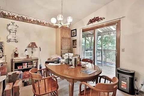 Upstairs dining area and sliding door to shared deck.