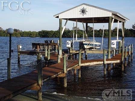 Dock, party pad to left, 20,000 # boatlift, huge boathouse