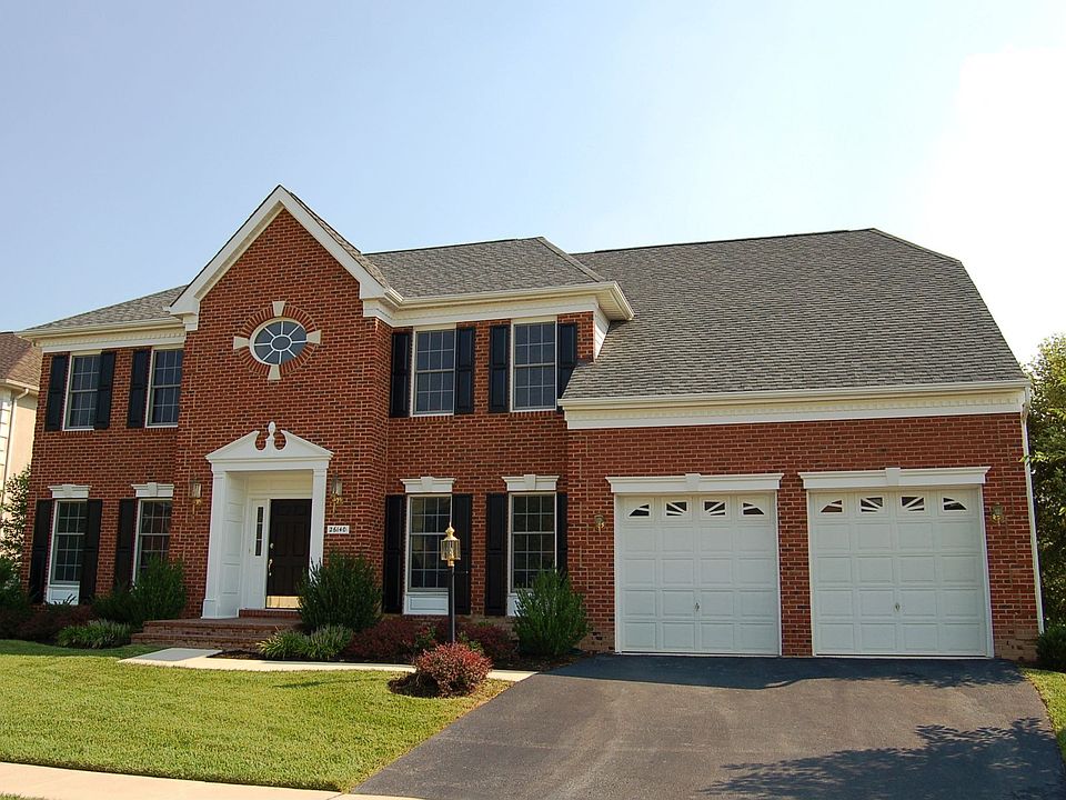Stunning brick front colonial backs to open common area.