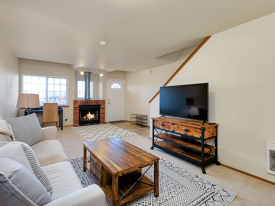 living space with wood burning fireplace