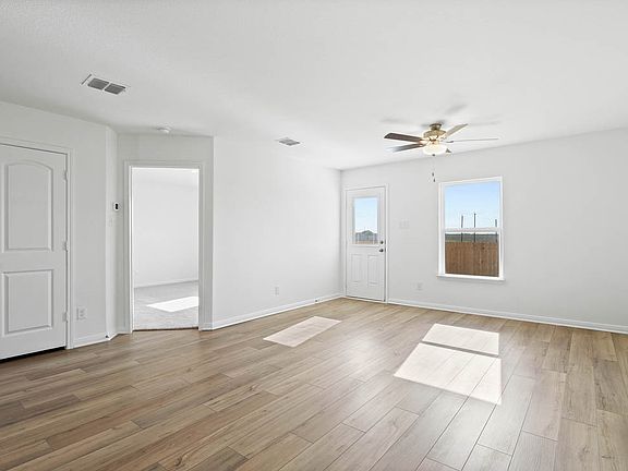 The spacious family room has backyard access.