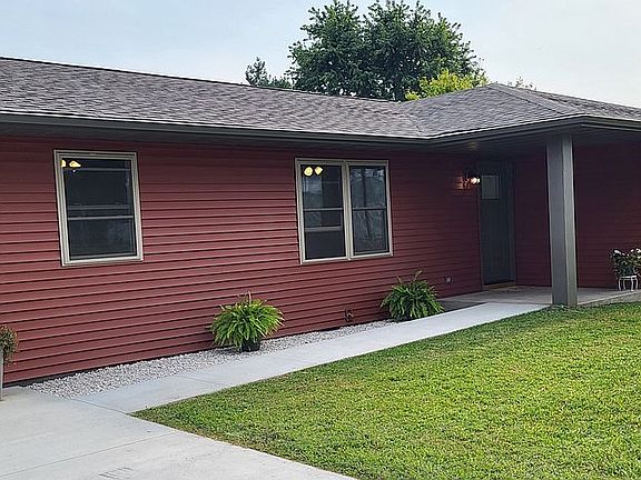 Sidewalk ramps to porch