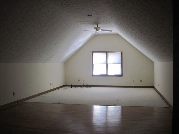 Upstairs Great Room
						:
						Other end of room has wet bar. 800 sq. ft. room. Hardwood and carpet.