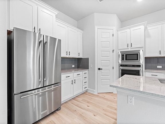 Stainless steel appliances are included