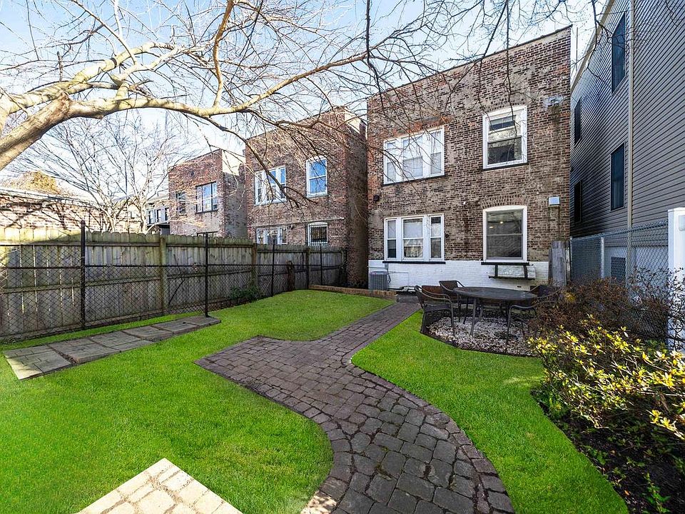 Yard (w/ virtually enhanced grass) & you'll see the stairs that go down under awning to Garden level from backyard