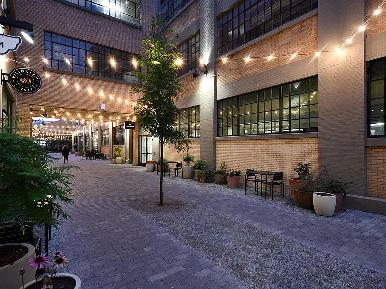 Redeveloped historic building featuring restaurants like Amelia's Bread, Barista Parlor, and Cafe Patachou. Features retail and fitness shops like Grounded Plant & Floral Co., Myriad + Fitness, and St'artup317. Only 1 mile from The Block.