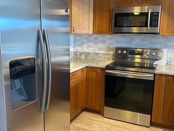 Remodeled Kitchen with Stainless Steel Appliances, Granite counters and Bamboo cabinets.