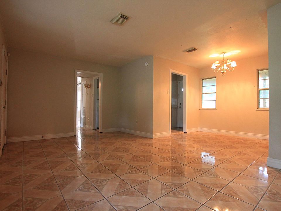 Spacious Living Room and Dinning Room with Tiles.