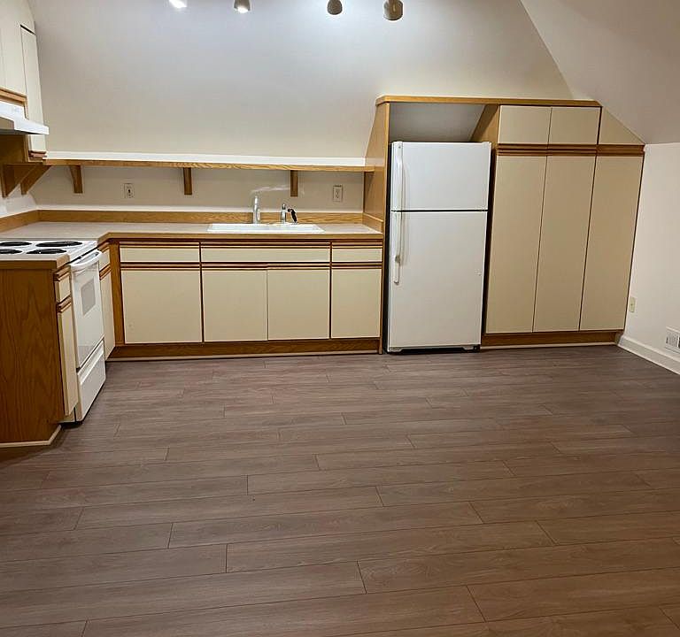 Kitchen area--full size stove and refrigerator. Lots of storage