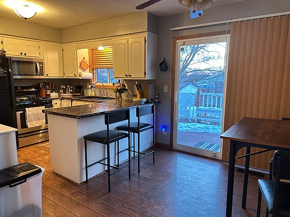 Open concept kitchen/dining room (sliding door exits to back deck)