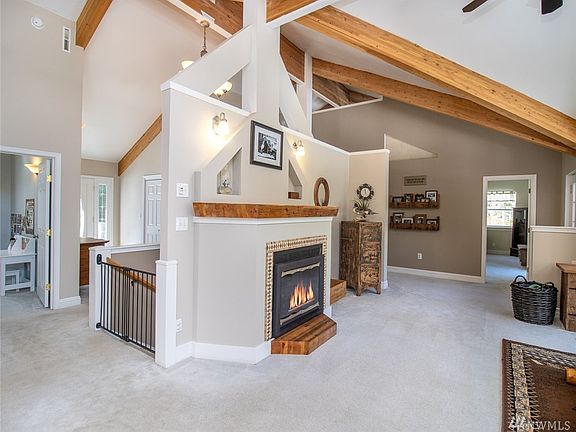 Propane fireplace insert anchors the living space.