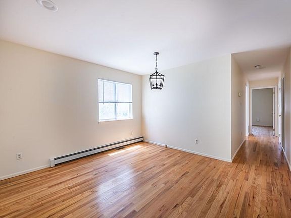 Dining room with peek down the hall to bedrooms
