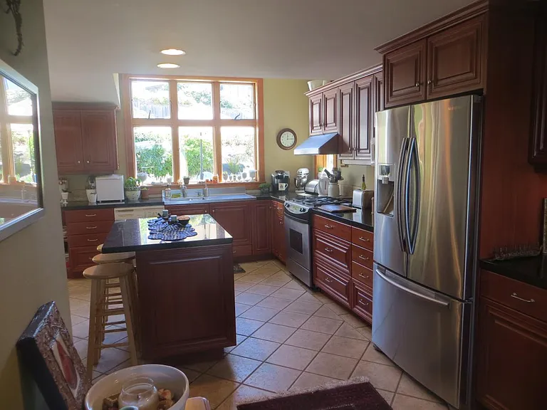 Kitchen with new refrigerator with ice-maker; Kitchenaid mix