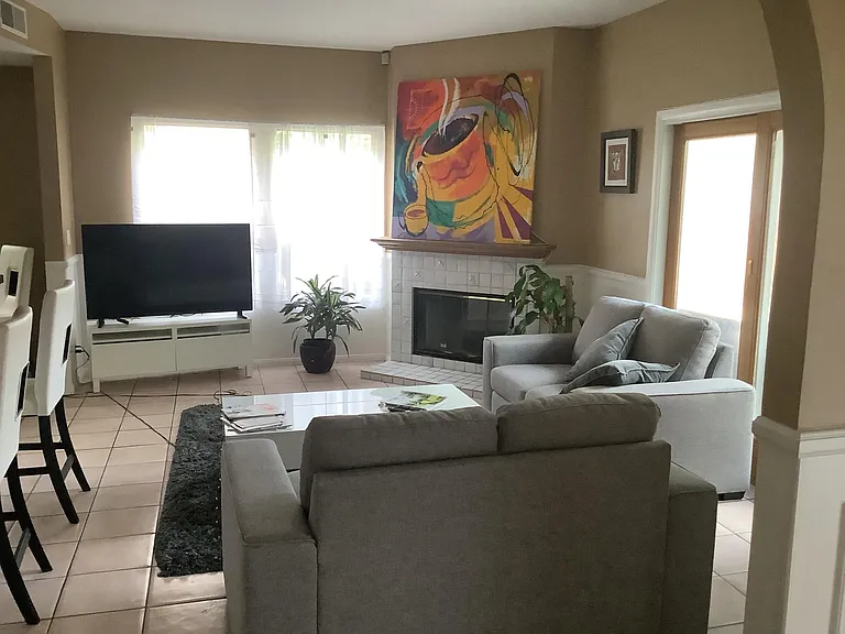 Family room off kitchen with French doors.