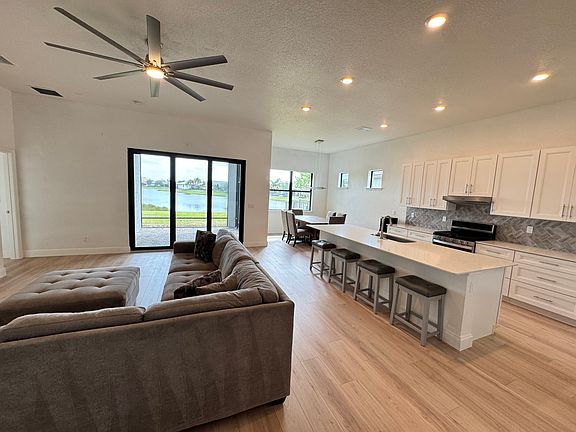 Family room, kitchen, and dining room with beautiful lake views