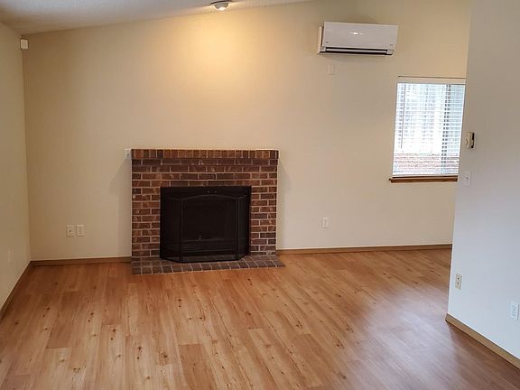 Living room with vaulted ceiling - looking at accent fireplace.