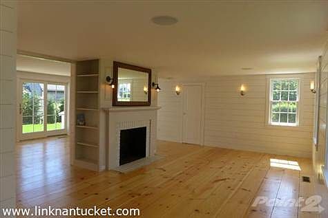 Living Room view to Dining area and sliders to back deck