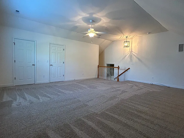 Bonus room is just five steps up from main living area, easy to keep an eye on kids playing