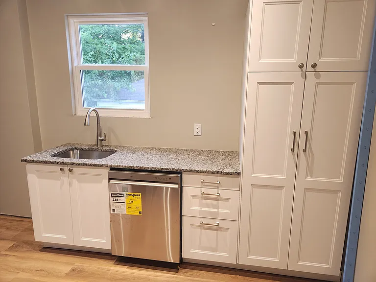 Brand new kitchen includes granite countertops, dishwasher and plenty of storage.