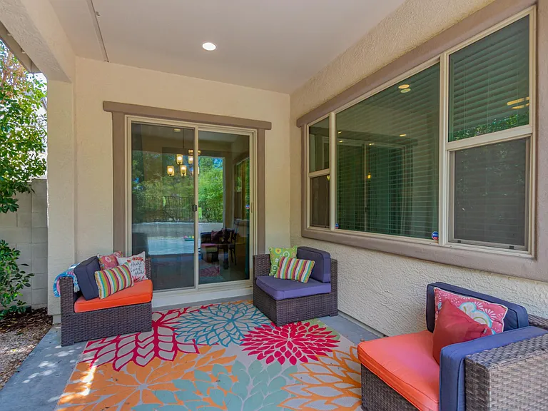 Back covered patio with Hollywood column hedges for privacy and greenery