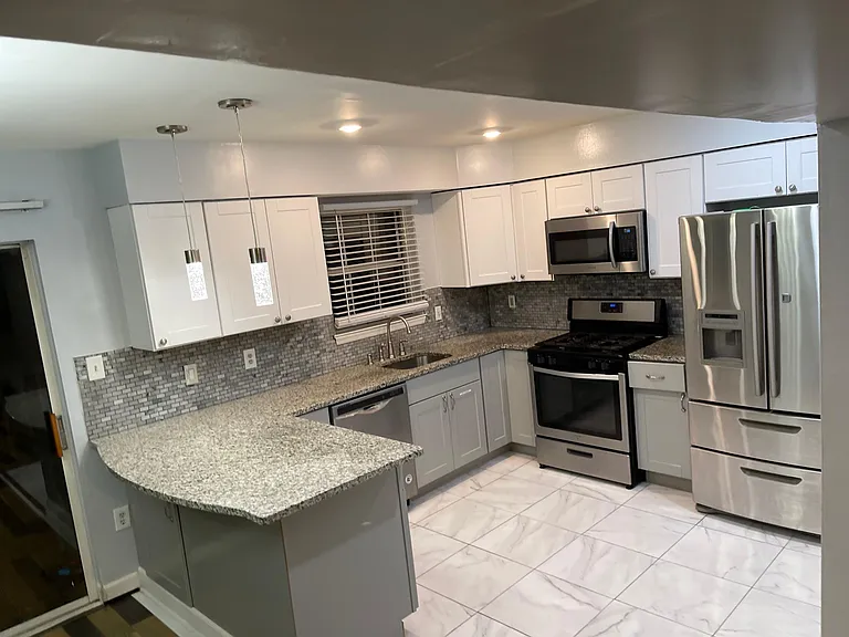 Modern upgraded kitchen Marble Countertops, Stainless Steel Brand new appliances, Recess Light Peninsula with Pendant Lights