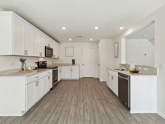 High-end gourmet kitchen with premium finishes and upgraded appliances model representation