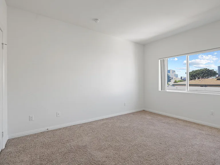 Bedroom with Closet and Large Windows
