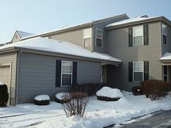 One car garage, one dedicated outdoor parking space with community parking spots to the side.
