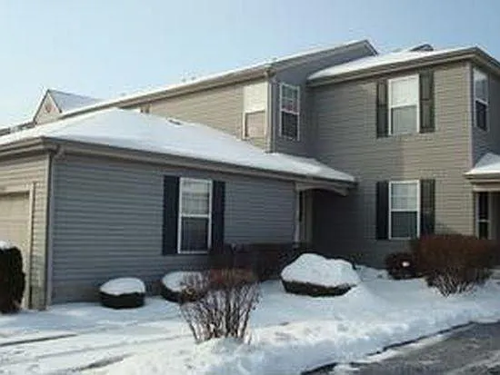 One car garage, one dedicated outdoor parking space with community parking spots to the side.
