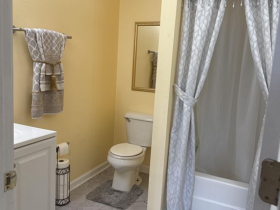 2 sink with bathtub, shower with shower handle