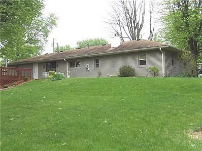 Veiw of the back side of this home offers landscaped & large back yard.