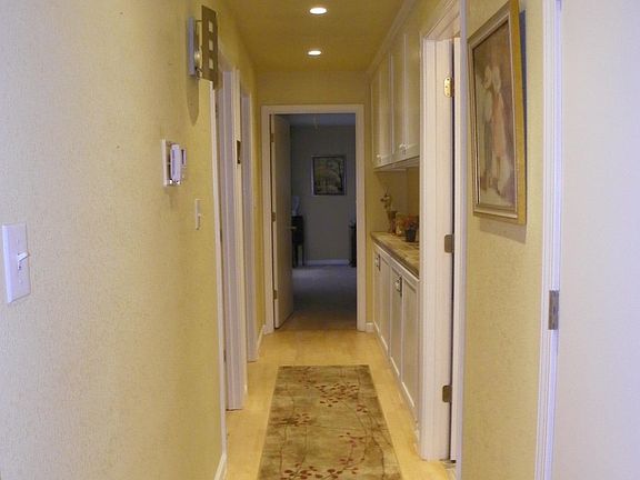 Hallway boasts  extra storage, storage, storage.