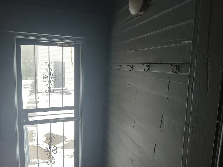 Back door and enclosed back porch off of Kitchen (far right)