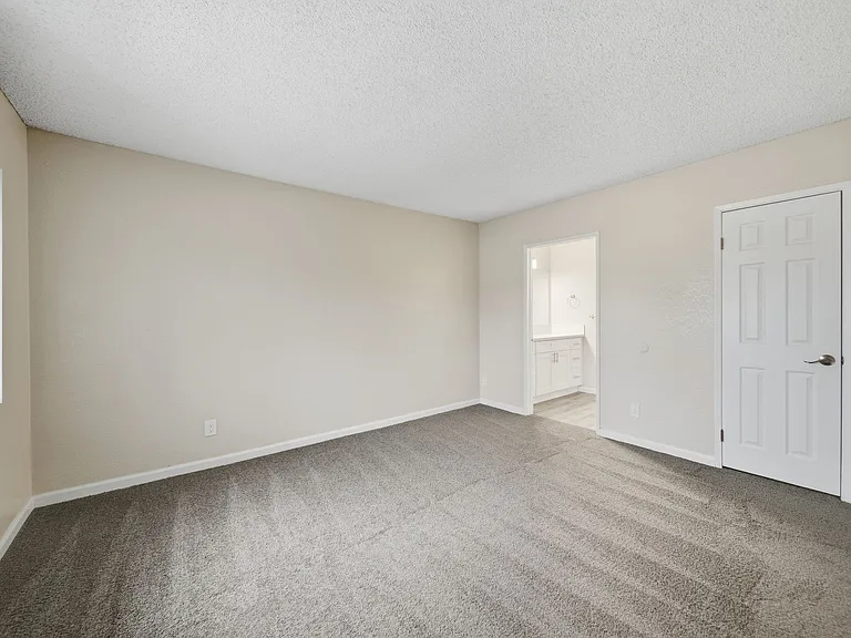 A Primary Bedroom at Midway Gardens Apartments