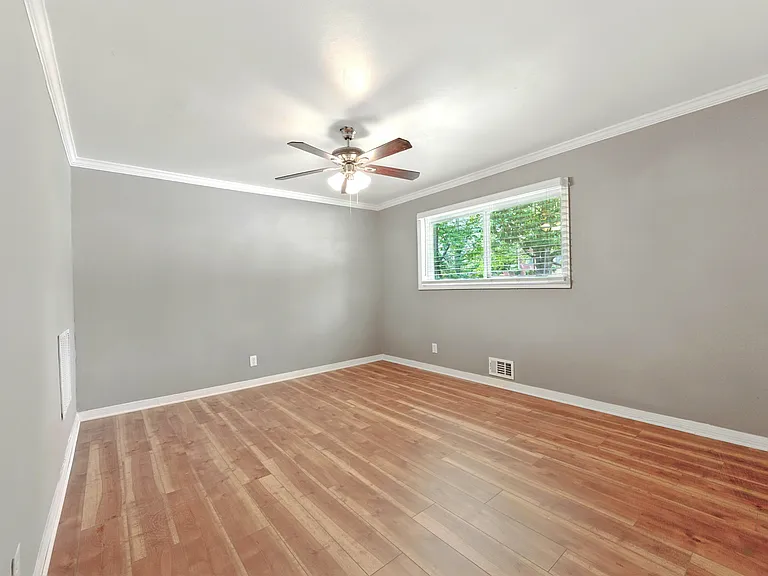 Primary Suite contains a ceiling fan for year-round comfort, and abundant closet space with built-in storage.