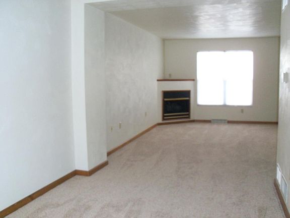 Spacious dining/living room with fireplace