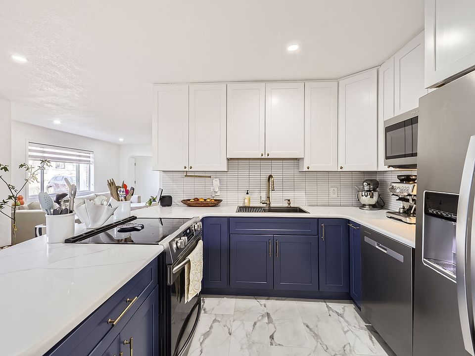 GORGEOUS modern kitchen with granite countertops and stainless steel appliances